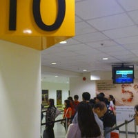 Photo taken at Gate 10 by Sherwin P. on 6/15/2012