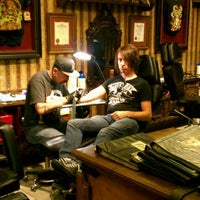 Photo taken at Studio City Tattoo &amp; Los Angeles Body Piercing by Desi R. on 5/12/2012
