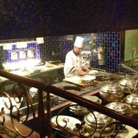 Photo taken at Moghul Restaurant by Angela C. on 4/22/2012