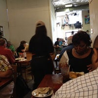 Photo taken at Cafe Reconcile by April B. on 5/16/2012