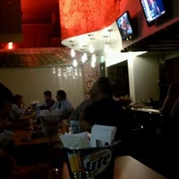 Photo taken at Traditions Bar &amp;amp; Grill by Eric on 8/21/2012
