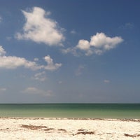 Photo taken at Beach at Carlouel Yacht Club by Christina M. on 4/14/2012