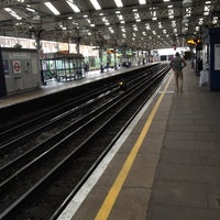 Photo taken at Queens Park London Underground Station by Chris B. on 7/14/2012