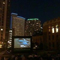 Photo taken at Fulton River District- Movies In The Park by K G. on 7/18/2012