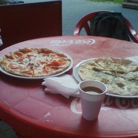 Photo taken at Gustosa Pizza by Alexandra S. on 6/27/2012