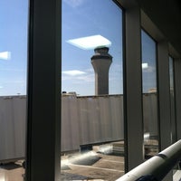 Photo taken at Gate A8 by Michelle H. on 6/13/2012