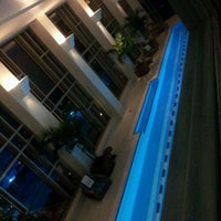 Photo taken at Pool at The Peninsula by Lee A. on 3/10/2012