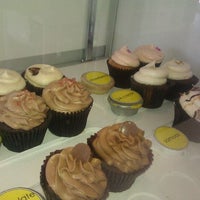 Photo taken at Endulge Cupcake Boutique by Joelle C. on 5/12/2012