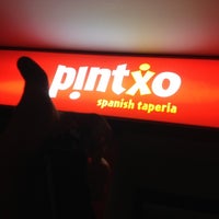 Photo taken at Pintxo Spanish Taperia Restaurant &amp;amp; Tapas Train Bar by Hank K. on 2/29/2012