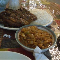 Photo taken at Yassa African Restaurant by Erinn T. on 8/15/2012