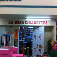 Photo taken at 98 Cent Plus Super Market &amp;amp; La Brea Cigarettes by Nadeem B. on 4/25/2012