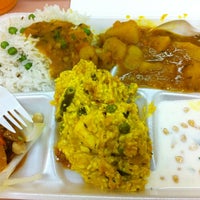 Photo taken at Indian Sweets and Spices by Chris L. on 3/12/2012
