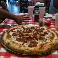 Photo taken at Authentic New York Pizza by Fernando M. on 6/30/2012