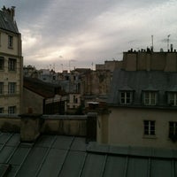 Photo taken at Bastille Hostel by Juliana R. on 7/19/2012