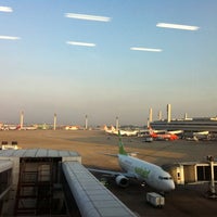 Photo taken at Gate 23 by Litiara B. on 5/28/2012