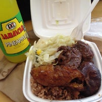 Photo taken at Golden Krust Caribbean Bakery and Grill by Christina A. on 8/7/2012