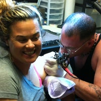 Foto diambil di East Coast Tattooing &amp;amp; Body Piercing oleh Jennifer W. pada 5/19/2012