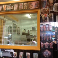 Photo taken at Inkstop Tattoo by Candace E. on 6/9/2012
