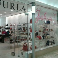 Photo taken at Furla by Marina M. on 4/19/2012
