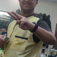 Photo taken at Dominguez Barbershop by Marcos S. on 3/16/2012