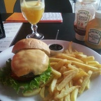 Photo taken at Three Burgers by Agostinho S. on 2/10/2012