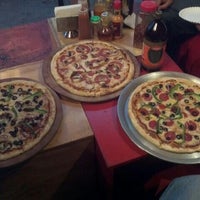 Photo taken at Cubo Rosso Pizza by Leon R. on 3/10/2012