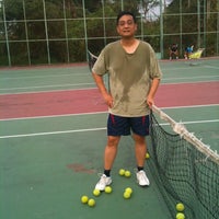Photo taken at Sermmit Tennis Court by Supadej C. on 3/24/2012