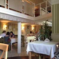 Photo taken at TOTO Village Cafe by Alina P. on 5/15/2012