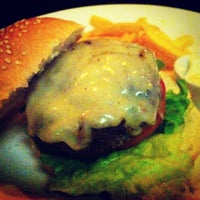 Photo taken at Three Burgers by Renata T. on 3/30/2012