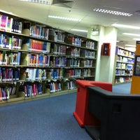 Photo taken at Lien Ying Chow Library 连瀛洲图书馆 by Jaynee L. on 8/2/2012