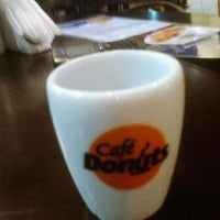 Photo taken at Café Donuts by Ricardo C. on 6/5/2012