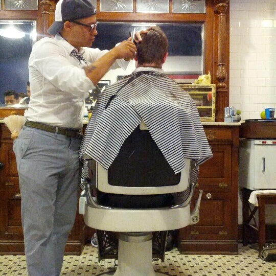 Photo taken at Neighborhood Cut and Shave Barber Shop by Dominic B. on 8/30/2012