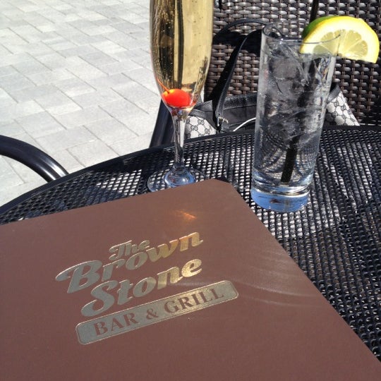 Photo taken at The Brown Stone Bar &amp; Grill by Natasia G. on 4/8/2012