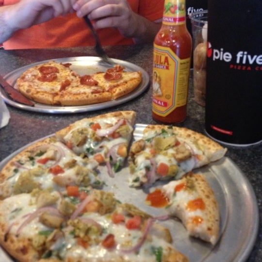 Photo taken at Pie Five Pizza by Amber H. on 9/5/2012