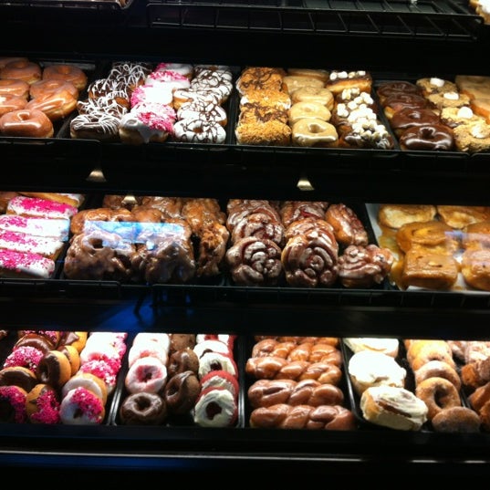 Photo taken at YoYo Donuts &amp; Coffee Bar by Connie M. on 2/12/2012