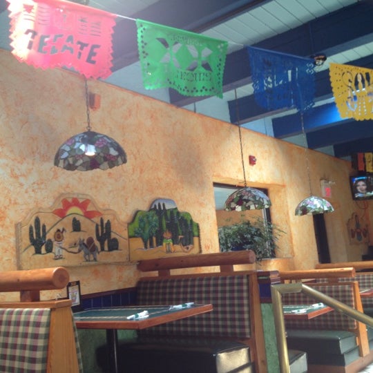 Photo taken at Cancún Family Mexican Restaurant by Allegra W. on 6/1/2012