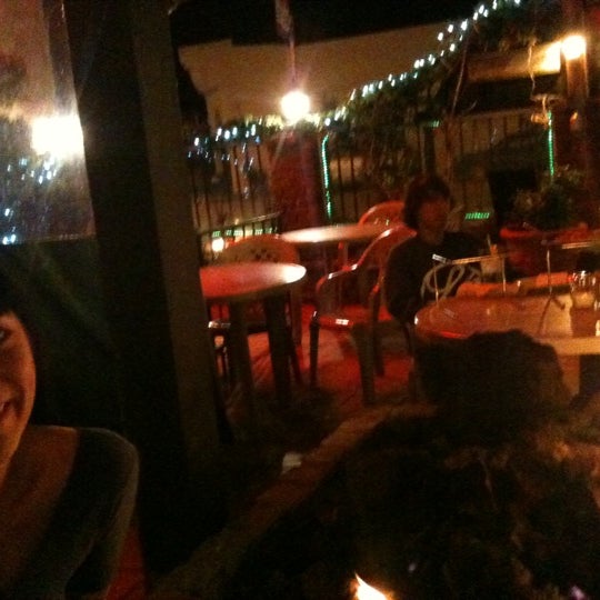 Photo taken at The Pizza Place &amp; Garden Cafe by holdensomething on 3/12/2011