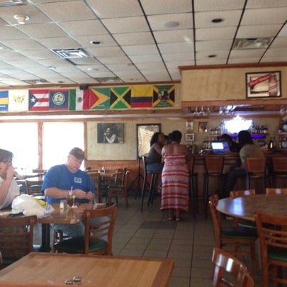 Photo taken at Jamaica Gates Caribbean Restaurant by Dino on 8/3/2012