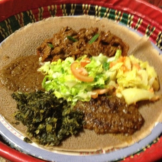 Photo taken at Mudai Ethiopian Restaurant by Vince C. on 2/11/2012