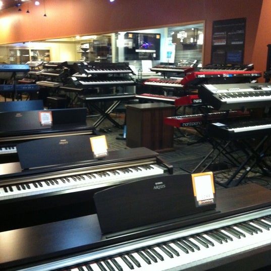 Photo taken at Long &amp; McQuade Musical Instruments by Victoria C. on 8/4/2011