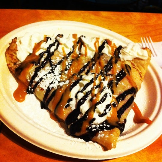 Strawberry filled, caramel and chocolate sauce crepe...Yum!