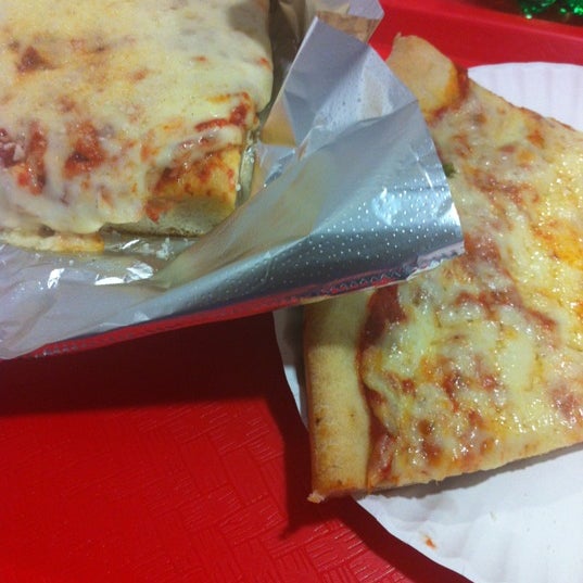 Photo taken at Famous Amadeus Pizza by Isaac O. on 3/9/2012