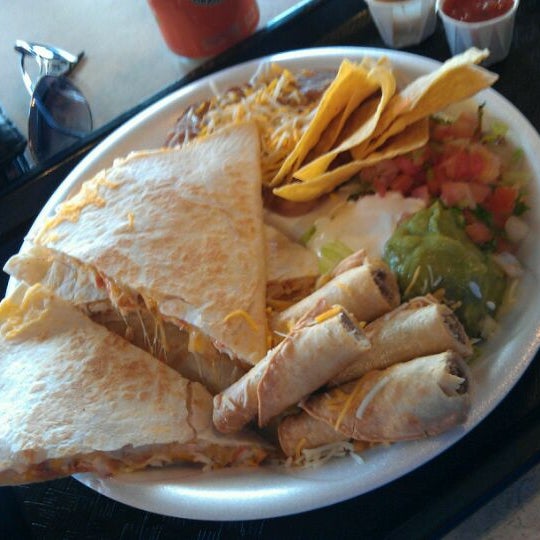 Photo taken at Taco Shop Mexican Grill by Rodolfo P. on 4/10/2012