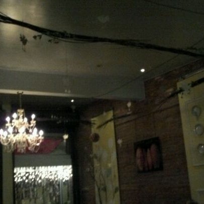Photo taken at Domku Bar &amp; Cafe by Olivia U. on 12/4/2011