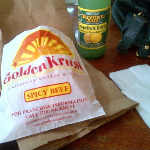 Photo taken at Golden Krust Caribbean Restaurant by Victoria T. on 8/19/2012