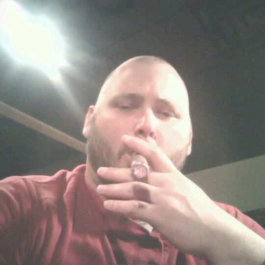 Photo taken at Cigar Club by Justin N. on 12/24/2011