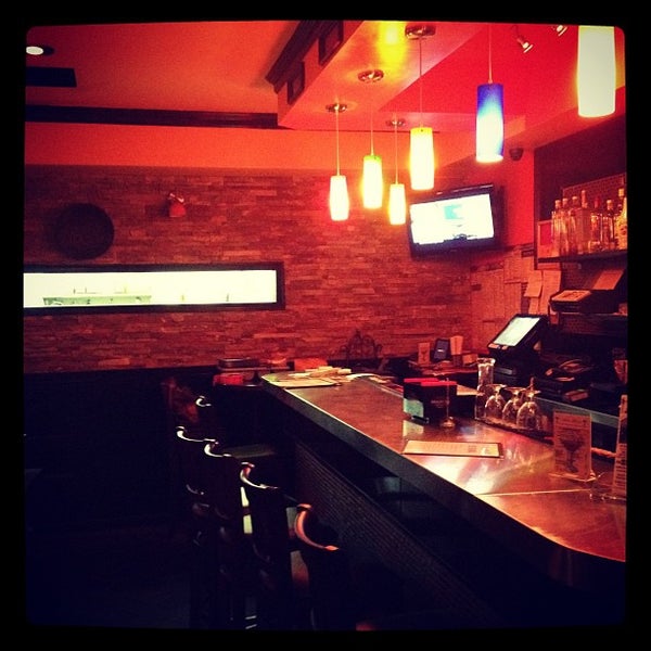 Photo taken at Janelle&#39;s Caribbean American Cuisine &amp; Bar by Matt on 8/23/2012