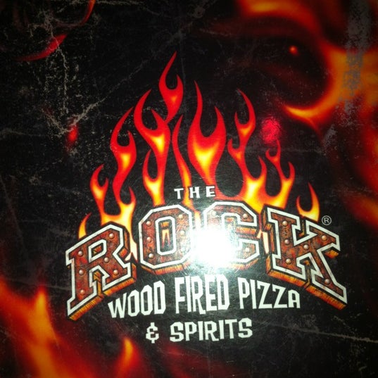 Photo taken at The Rock Wood Fired Pizza by Tyleen S. on 4/1/2012