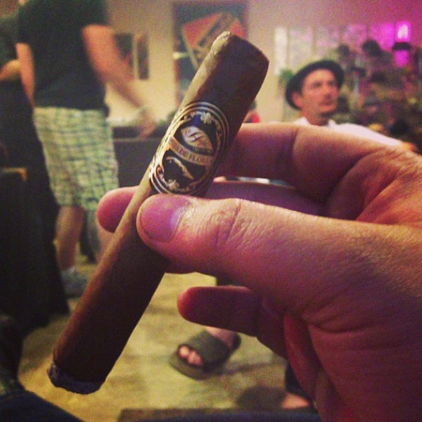 Photo taken at En Fuego Cigars &amp; Lounge by Timothy P. on 7/14/2013