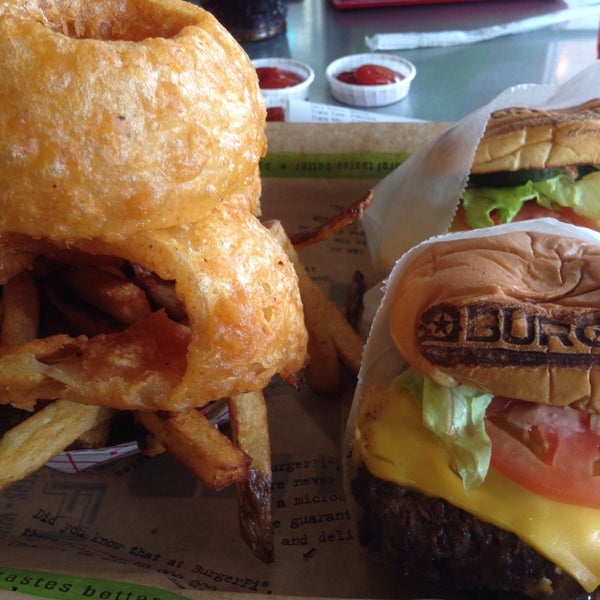 Photo taken at BurgerFi by JmMster J. on 1/30/2014